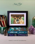 Baby Deer Peeking Under Fence Framed Print